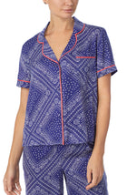 A lady wearing blue short sleeve chelsea pj set with bandana babe print.