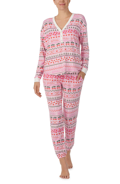 A lady wearing pink Long Sleeve Harper Long Pj Set with Festive Fling print.