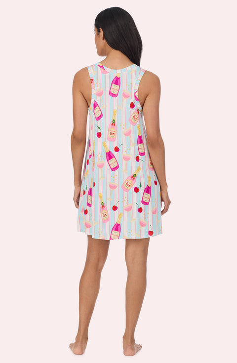 A Lady Wearing Kellie Knit Chemise In Bottle Service in a back view standing pose