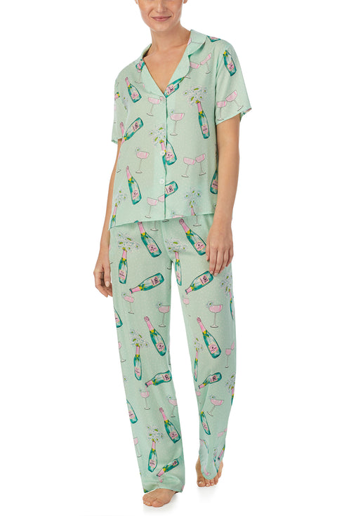 A lady wearing green short sleeve Madison Pj Set In Bubbly Blossoms 