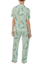 A lady wearing green short sleeve Madison Pj Set In Bubbly Blossoms 