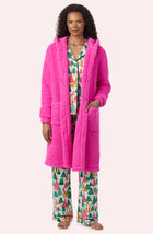 A Lady Wearing Maisie Sherpa Long Jacket In Holly Jolly Pink