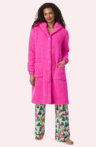 A Lady Wearing Maisie Sherpa Long Jacket In Holly Jolly Pink posing in a front facing view
