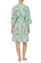 A lady wearing green short sleeve Sierra Robe In Bubbly Blossoms