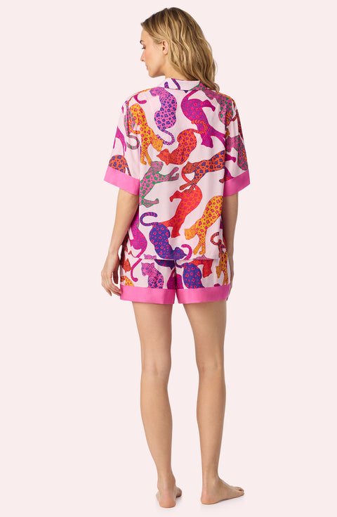 A Lady Wearing Georgia Short Woven PJ Set in Pink Prowler Back View
