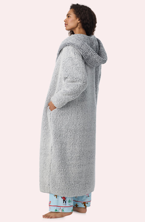 A Lady Wearing Aubrie Sherpa Long Jacket In Frosted Slate in a back visible side view pose