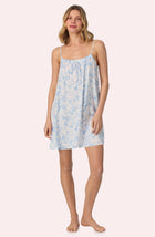 A lady wearing Izzy Woven Chemise In Butterflies & Bows