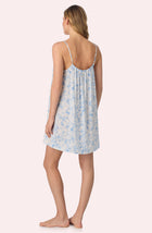 A lady wearing Izzy Woven Chemise In Butterflies & Bows