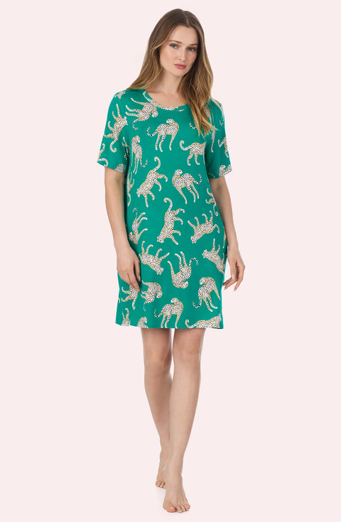 A Lady Wearing Mila Knit Sleepshirt In Safari Spots