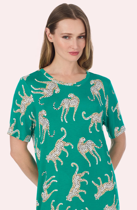 A Lady Wearing Mila Knit Sleepshirt In Safari Spots in a front facing close up shot