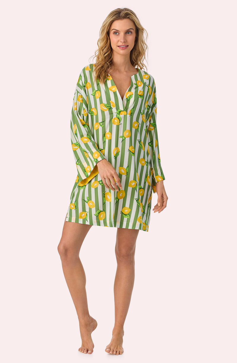 A lady wearing Simone Woven Tunic In Lemonade Stand Stripe