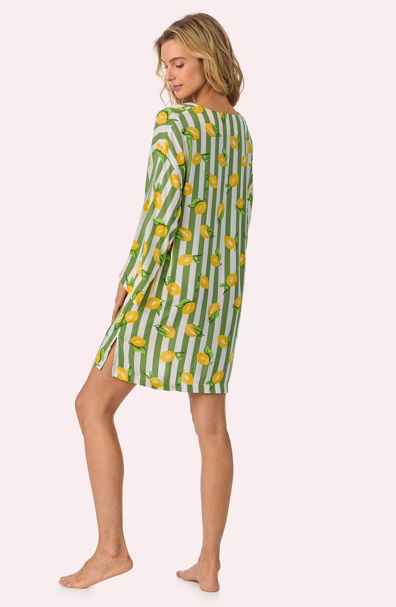 A lady wearing Simone Woven Tunic In Lemonade Stand Stripe