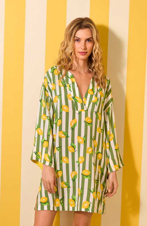 A lady wearing Simone Woven Tunic In Lemonade Stand Stripe