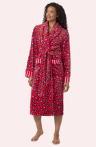 A Lady Wearing Risa Chenille Robe In Wild Spots & Stripes in a front view, side angle pose