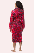 A Lady Wearing Risa Chenille Robe In Wild Spots & Stripes in a back view pose