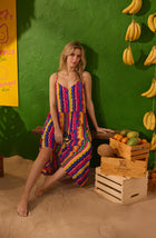 A Lady Wearing Layla Woven Chemise In Fiesta Stripe in a Front Facing Sitting Pose