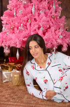 A lady wearing Charlotte Knit Pj Set In Ice Blue Sippin' With Santa