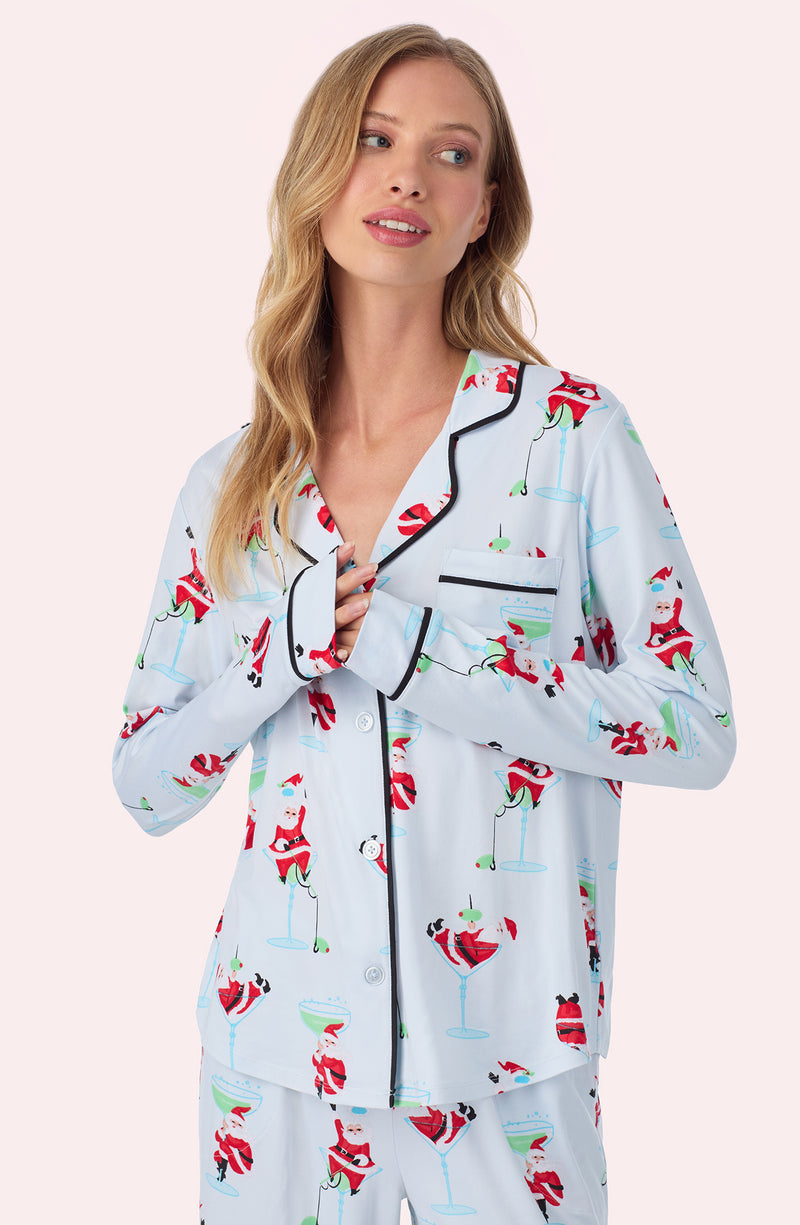 A lady wearing Charlotte Knit Pj Set In Ice Blue Sippin' With Santa