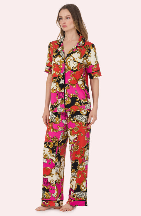 A Lady Wearing Sienna Long Knit Pj Set In Cheetah Chic in a side angled pose