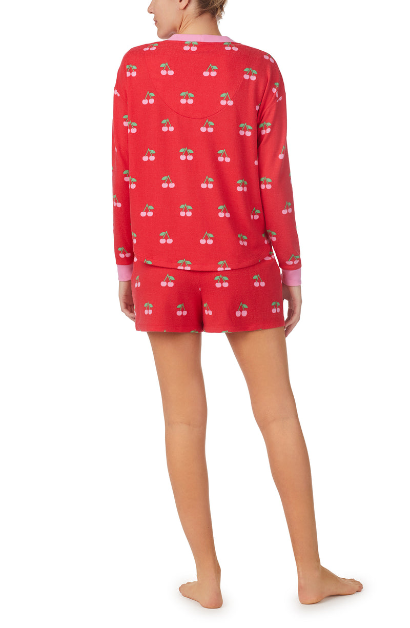 A lady wearing Red Long Sleeve Harper 3 Pc Set with Cherry Crush print.