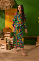 A Lady Wearing Cara Woven Robe In Jungle Breeze  In a Side Angle Walking Pose