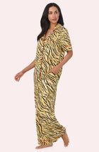 A Lady Wearing Sienna Long Knit Pj Set In Tiger Glam in a side angled view pose