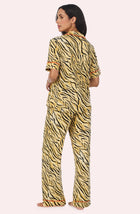 A Lady Wearing Sienna Long Knit Pj Set In Tiger Glam in a back view pose