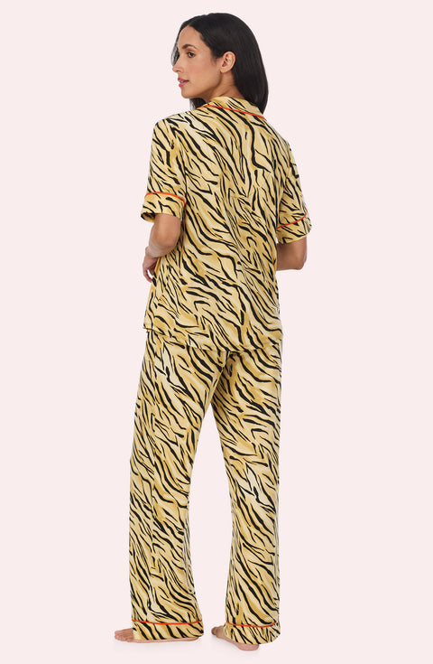 A Lady Wearing Sienna Long Knit Pj Set In Tiger Glam in a back view pose