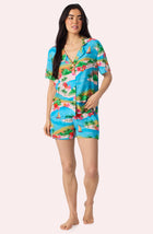A Lady Wearing Amelia Short Woven Pj Set In Sunset Escape facing front view