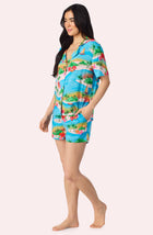 A Lady Wearing Amelia Short Woven Pj Set In Sunset Escape posing side angle view