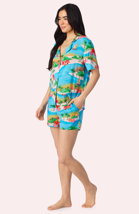 A Lady Wearing Amelia Short Woven Pj Set In Sunset Escape posing side angle view