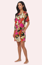 A Lady Wearing Sammi Knit Sleepshirt In Cheetah Chic in a side angled pose