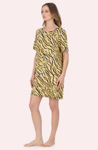 A Lady Wearing Sammi Knit Sleepshirt In Tiger Glam in a full view side angled pose