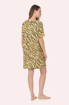 A Lady Wearing Sammi Knit Sleepshirt In Tiger Glam in a back view pose