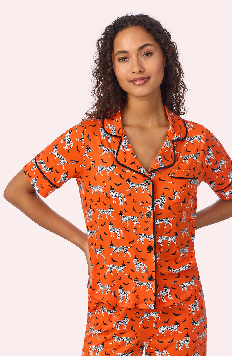 A lady wearing Arizona Long Knit Pj Set In Spooky Season