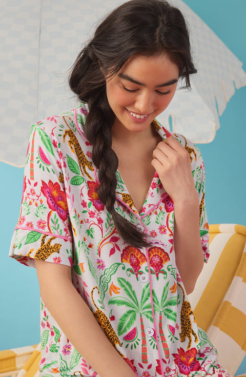 A Lady Wearing Dakota Cropped Knit Pj Set In Rainforest Escape shown in a close up view with a smile on her face looking down