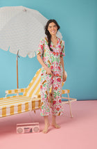 A Lady Wearing Dakota Cropped Knit Pj Set In Rainforest Escape shown in a full standing pose with a smile on her face