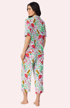 A Lady Wearing Dakota Cropped Knit Pj Set In Rainforest Escape posing with a back view