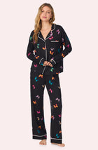 A lady wearing Collette Knit Pj Set In Midnight Butterfly