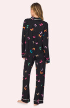 A lady wearing Collette Knit Pj Set In Midnight Butterfly