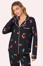 A lady wearing Collette Knit Pj Set In Midnight Butterfly