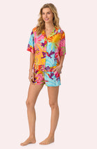 A lady wearing Georgia Short Woven Pj Set In Sunset Greeting