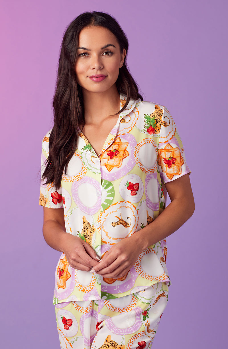 A lady wearing yellow short sleeve madison pj set in brunch please