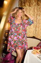 A lady wearing Remi Knit Robe And Chemise Set In Scarlet Safari