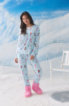 A Lady Wearing Stevie Knit Pj Set In Champagne Slopes in a front view standing pose with pink snow boots