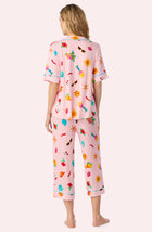 A Lady Wearing Dakota Cropped Knit Pj Set In Island Party posing back view