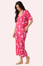 A Lady Wearing Dakota Cropped Knit Pj Set In On The Rocks posing side angle view