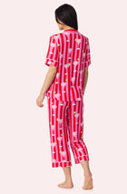 A Lady Wearing Dakota Cropped Knit Pj Set In On The Rocks posing back view