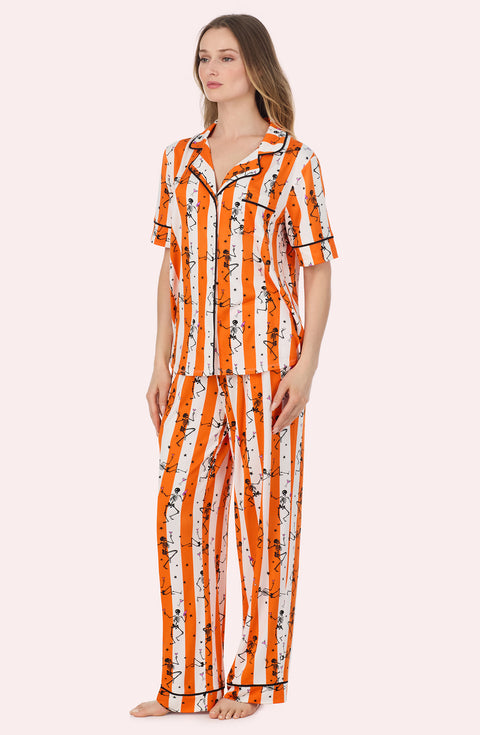 A Lady Wearing Sienna Long Knit Pj Set In Haunted Happy Hour posing in a side angled view pose