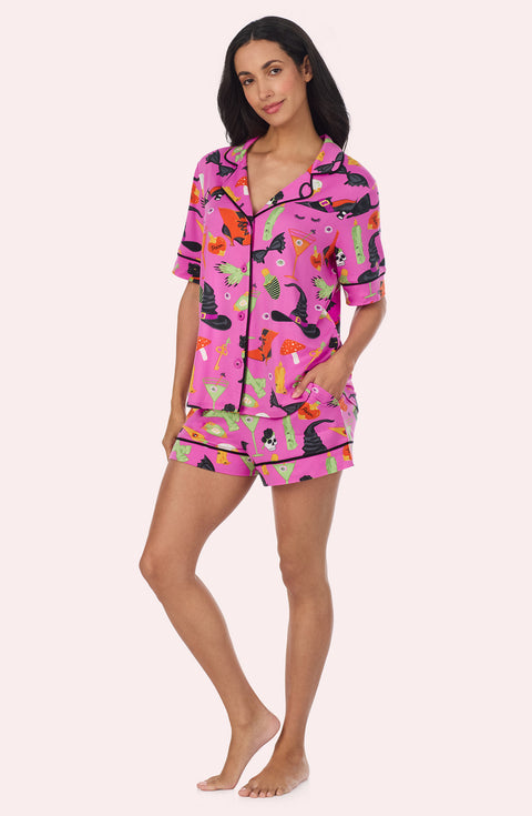 A Lady Wearing Siennna Short Knit Pj Set In Potion Commotion in a front facing side angle pose